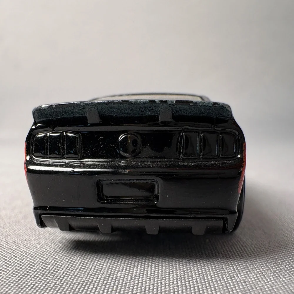 Hot Wheels 07 Ford Mustang Black with Red Stripes Diecast Car 1/64 Scale C46